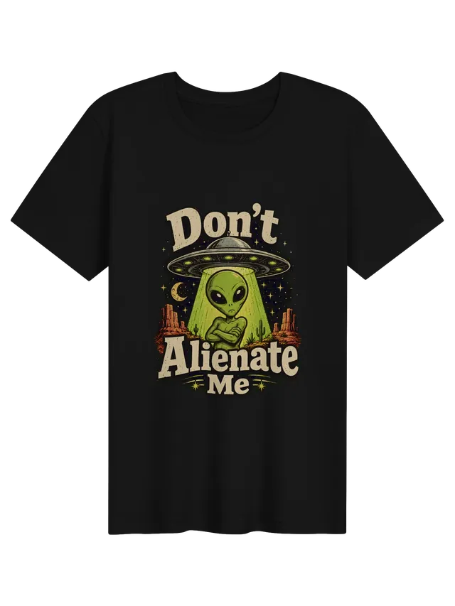 Don't Alienate Me tee in black with a pouting green alien under a UFO in the desert, by LOLsies